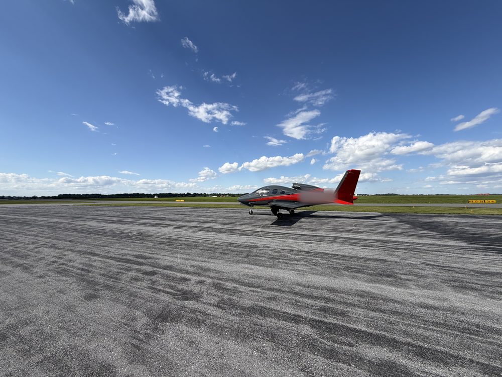 Cirrus SF50 Vision Jet on the ramp under a blue sky